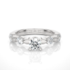 Picture of 0.90 Carat solitare surrounded by smaller Diamonds in a Floral Design.