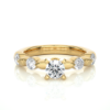 Picture of 0.90 Carat solitare surrounded by smaller Diamonds in a Floral Design.