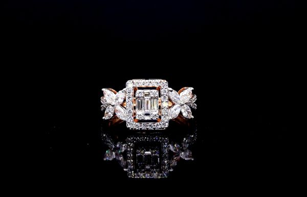 Picture of A Ring Featuring a Central Baguette Diamond Surrounded By Smaller Diamonds.