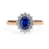 Picture of Oval Cut Blue Sapphire Ring, Encircled By A Halo Of Diamonds.