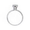 Picture of 1.25 Carat Pear Solitaire Ring Adorned with Smaller Diamonds.