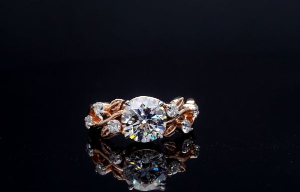 Picture of 2 Carat LGD, nestled in delicate leaf inspired setting adorned with smaller diamonds.