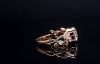 Picture of 2 Carat LGD, nestled in delicate leaf inspired setting adorned with smaller diamonds.