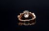 Picture of 2 Carat LGD, nestled in delicate leaf inspired setting adorned with smaller diamonds.