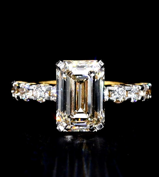 Picture of 5.15 Carat Emerald Cut Ring Accented With A Brilliant Row Of Sparkling Side Diamonds.